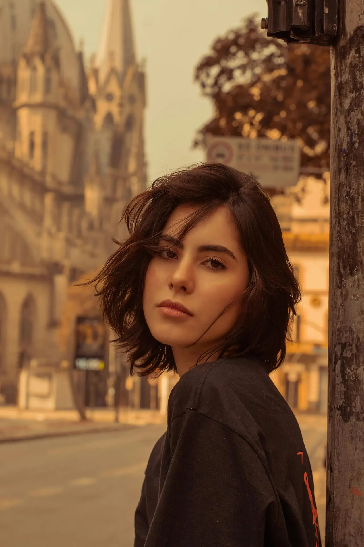 Stylish portrait of a woman with short hair in downtown São Paulo, Brazil.